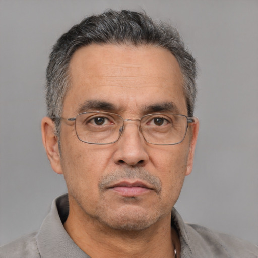 Neutral white middle-aged male with short  gray hair and brown eyes