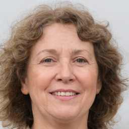 Joyful white middle-aged female with medium  brown hair and brown eyes