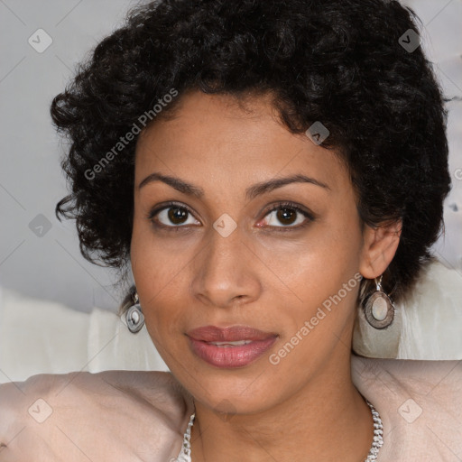 Joyful black young-adult female with long  brown hair and brown eyes