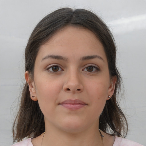 Neutral white young-adult female with medium  brown hair and brown eyes