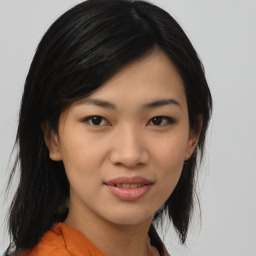 Joyful asian young-adult female with medium  black hair and brown eyes