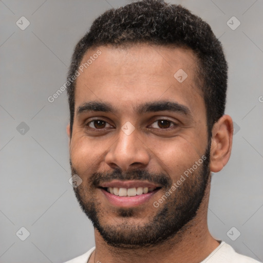 Joyful white young-adult male with short  black hair and brown eyes