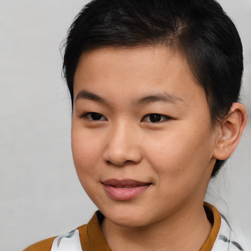 Joyful asian young-adult female with short  brown hair and brown eyes