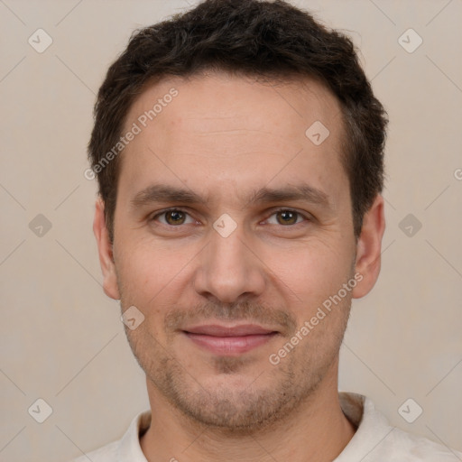 Joyful white adult male with short  brown hair and brown eyes