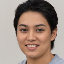 Joyful asian young-adult female with short  black hair and brown eyes