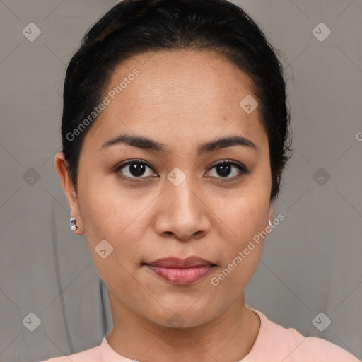 Joyful latino young-adult female with short  brown hair and brown eyes