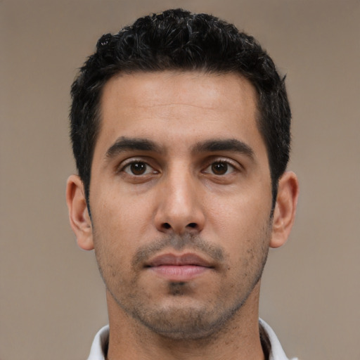 Neutral latino young-adult male with short  black hair and brown eyes
