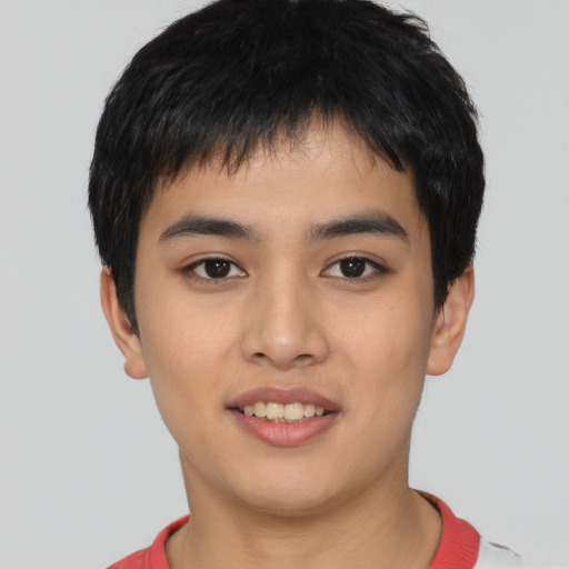 Joyful asian young-adult male with short  black hair and brown eyes