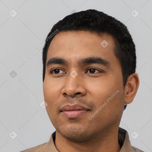 Neutral latino young-adult male with short  black hair and brown eyes