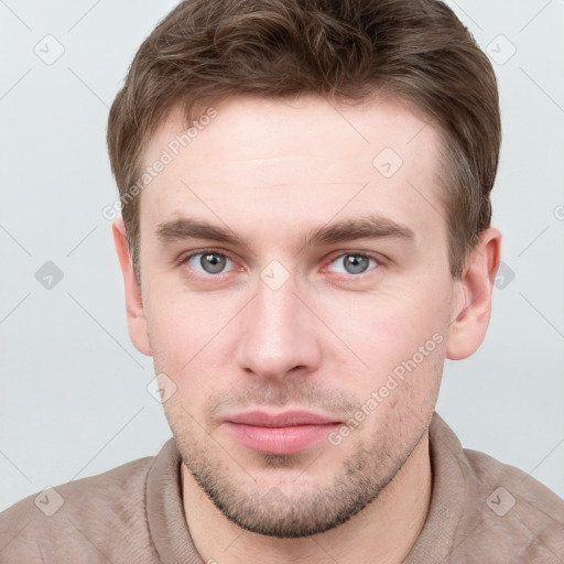 Neutral white young-adult male with short  brown hair and grey eyes