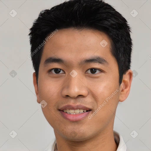 Joyful asian young-adult male with short  black hair and brown eyes