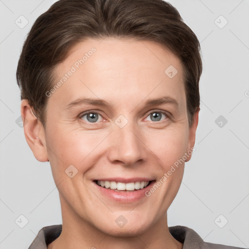 Joyful white young-adult female with short  brown hair and grey eyes