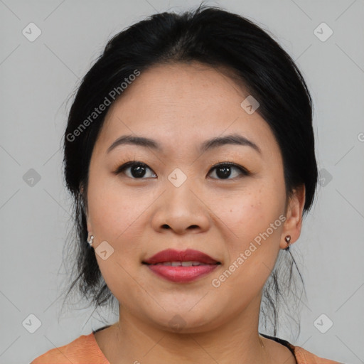 Joyful asian young-adult female with medium  black hair and brown eyes