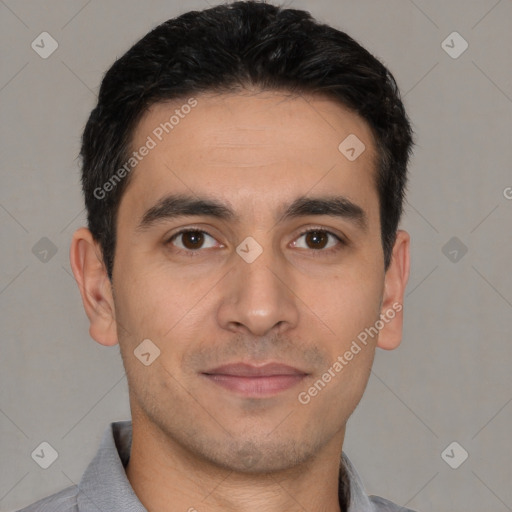 Joyful white young-adult male with short  black hair and brown eyes