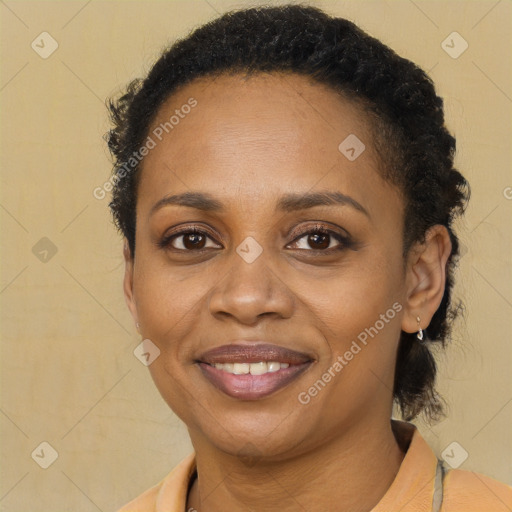 Joyful latino young-adult female with short  brown hair and brown eyes