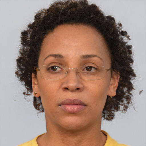 Neutral black adult female with short  brown hair and brown eyes