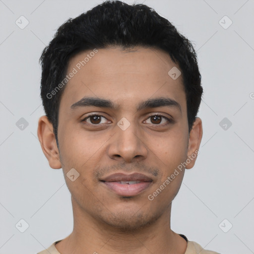 Joyful latino young-adult male with short  black hair and brown eyes