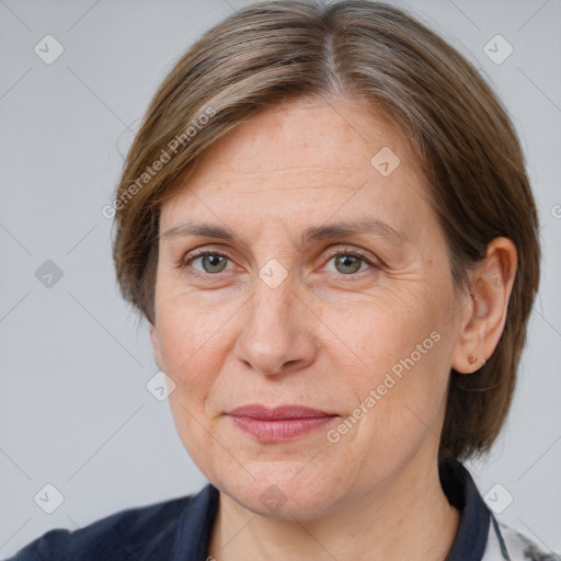 Joyful white adult female with medium  brown hair and brown eyes