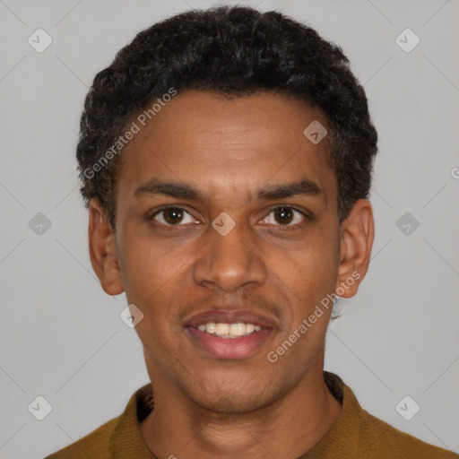 Joyful black young-adult male with short  black hair and brown eyes