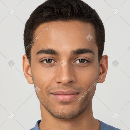 Joyful latino young-adult male with short  brown hair and brown eyes