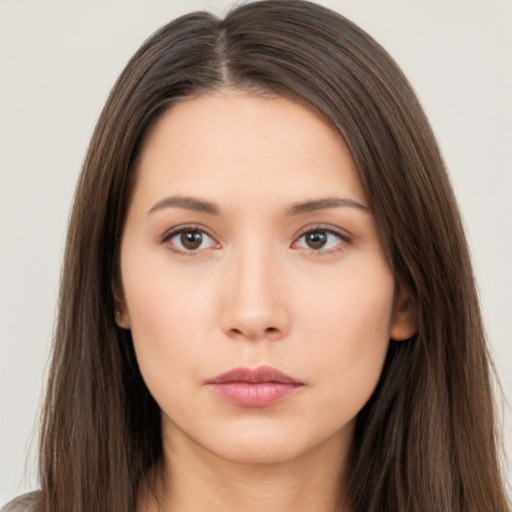 Neutral white young-adult female with long  brown hair and brown eyes