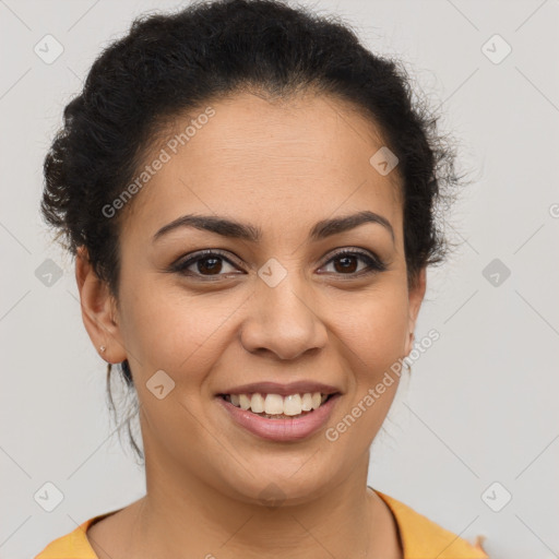 Joyful latino young-adult female with short  brown hair and brown eyes