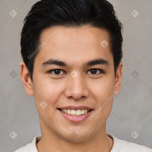 Joyful latino young-adult male with short  brown hair and brown eyes