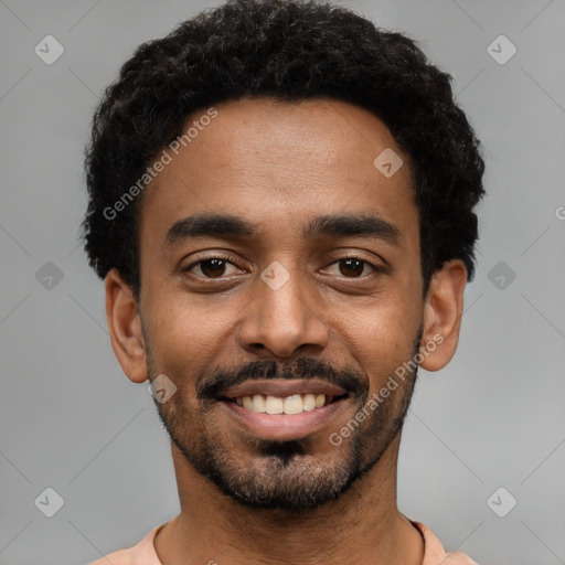 Joyful black young-adult male with short  black hair and brown eyes