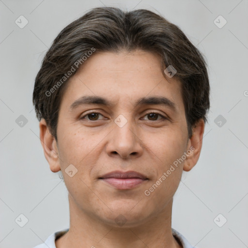 Joyful white adult male with short  brown hair and brown eyes