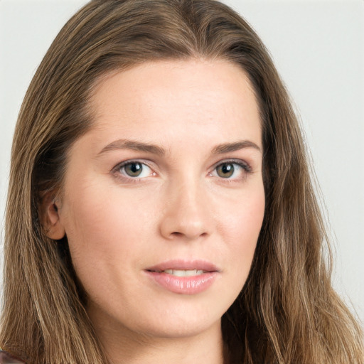 Neutral white young-adult female with long  brown hair and green eyes