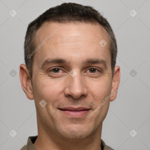 Joyful white adult male with short  brown hair and brown eyes