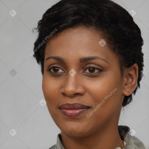 Joyful black young-adult female with short  brown hair and brown eyes