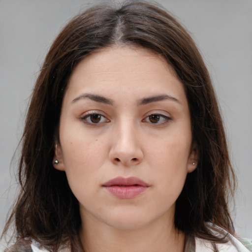 Neutral white young-adult female with medium  brown hair and brown eyes