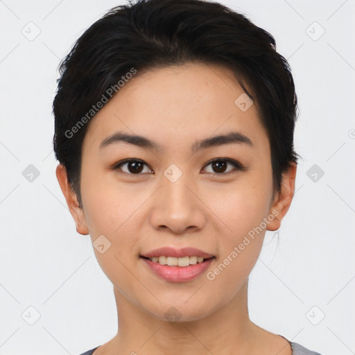 Joyful asian young-adult female with short  black hair and brown eyes