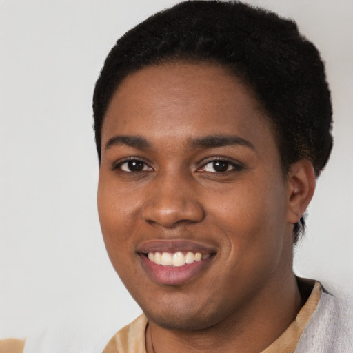 Joyful black young-adult female with short  black hair and brown eyes