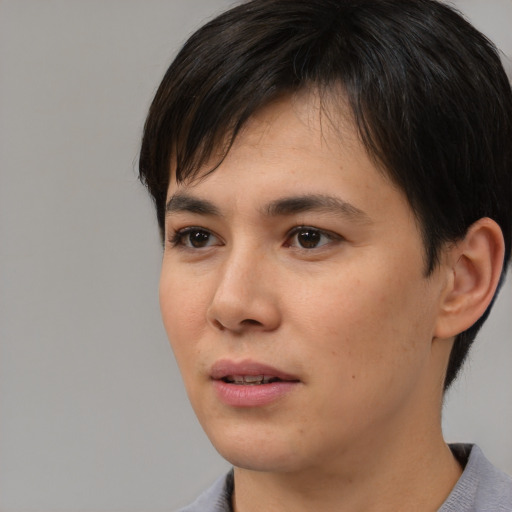 Neutral white young-adult female with short  black hair and brown eyes