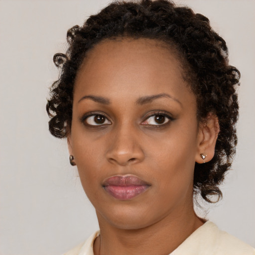 Neutral black young-adult female with short  brown hair and brown eyes