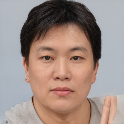 Neutral asian young-adult male with short  brown hair and brown eyes