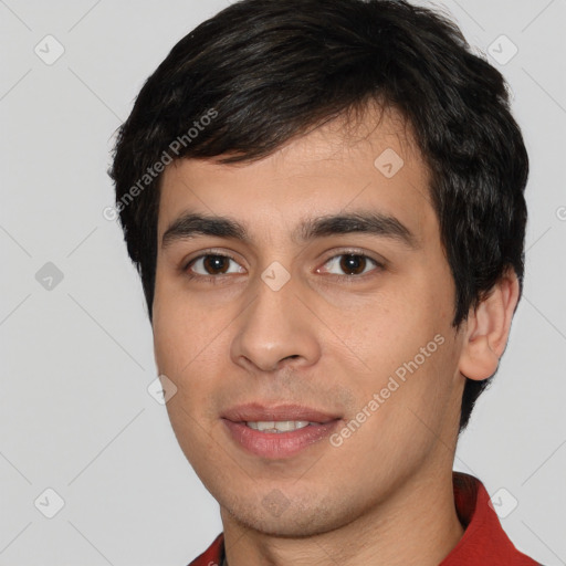 Joyful white young-adult male with short  black hair and brown eyes