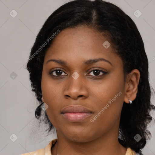 Joyful black young-adult female with medium  black hair and brown eyes