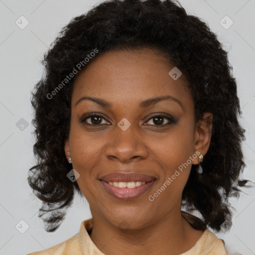 Joyful black young-adult female with medium  brown hair and brown eyes