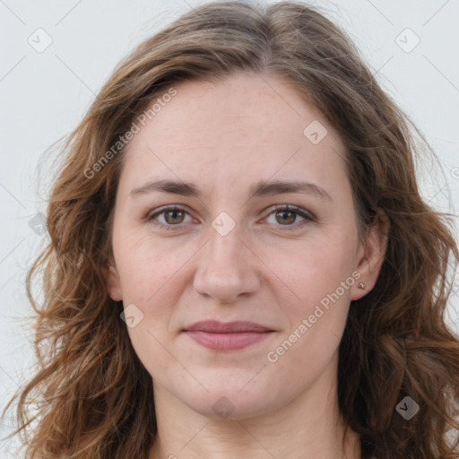 Joyful white adult female with long  brown hair and grey eyes