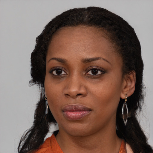 Neutral black young-adult female with medium  black hair and brown eyes