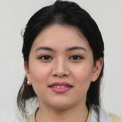 Joyful asian young-adult female with medium  black hair and brown eyes