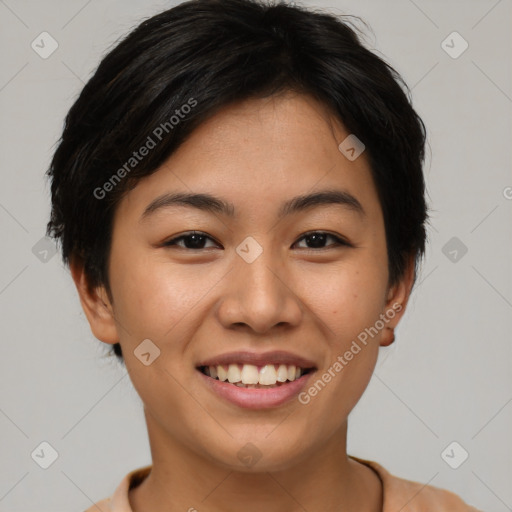 Joyful asian young-adult female with short  brown hair and brown eyes