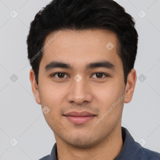 Joyful white young-adult male with short  black hair and brown eyes