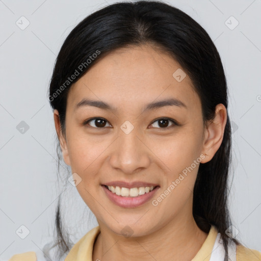 Joyful asian young-adult female with medium  brown hair and brown eyes