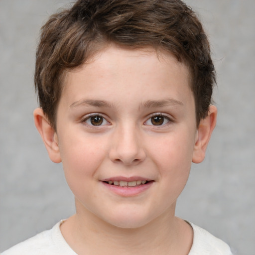 Joyful white child male with short  brown hair and brown eyes