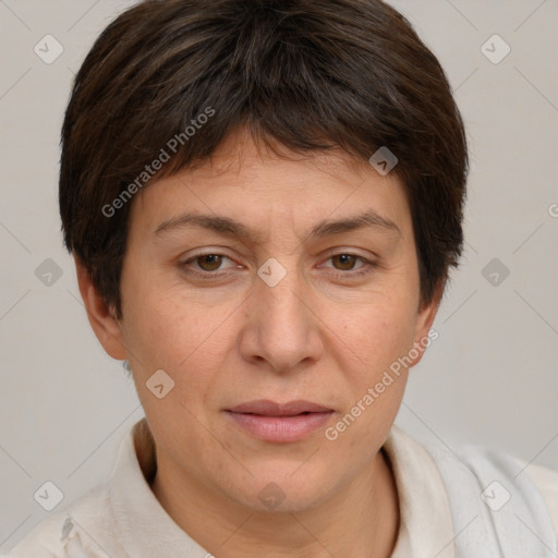 Joyful white adult female with short  brown hair and brown eyes