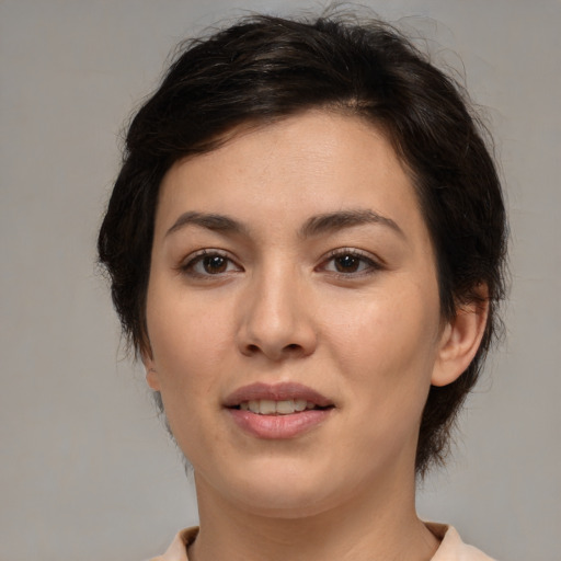 Joyful white young-adult female with medium  brown hair and brown eyes